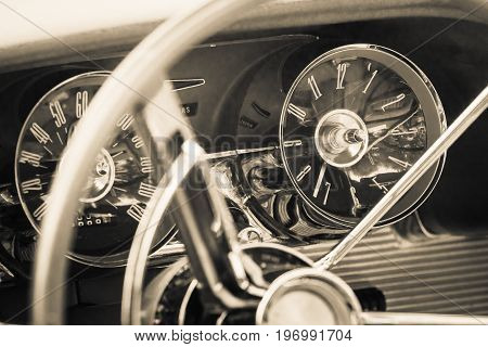PAAREN IM GLIEN GERMANY - MAY 23 2015: The dashboard of a personal luxury car Ford Thunderbird (third generation). Vintage toning. Stylization. The oldtimer show in MAFZ.
