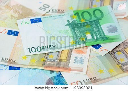 Money Variuos Kinds Of Euro Currency Bills With 100 Bill On Top - Soft Focus