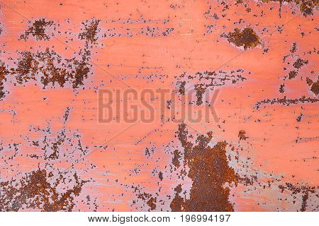 Rust on old red paint. Foci of rust on metal.