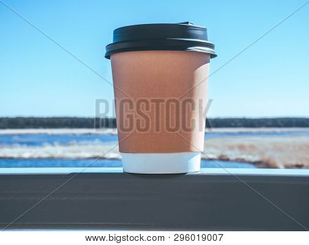 Paper Cup Of Coffee On Natural Morning Background. Film Effect.