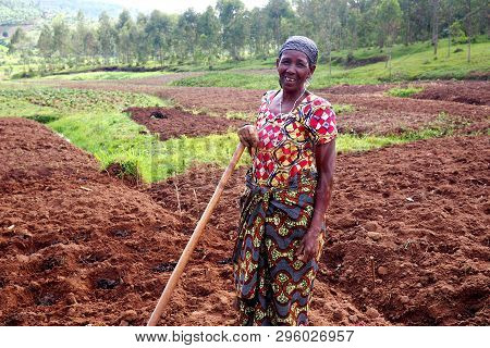 Kinazi, Rwanda - 14 November 2018 : An African Subsistence Farmer In Her Fields