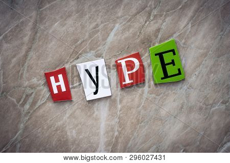 A Word Writing Text Hype On Brown Background. Banner With The Inscription - Hype From Colorful Lette