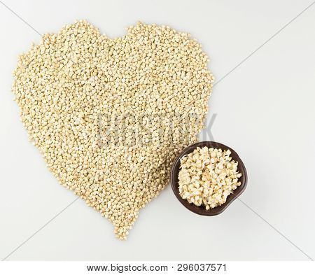 Sprouts of green buckwheat on white background. Macro shot raw organic buckwheat plant. Vegan germinated sprouts, vegetarian cuisine. Healthy diet buckwheat porridge food. 