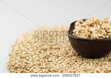 Sprouts of green buckwheat on white background. Macro shot raw organic buckwheat plant. Vegan germinated sprouts, vegetarian cuisine. Healthy diet buckwheat porridge food. 