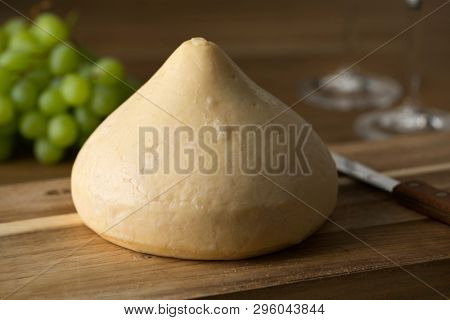 Single whole Tetilla cows cheese made in Galicia, Spain