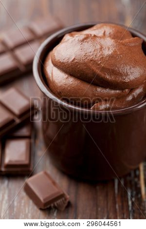 closeup of freshly made chocolate mousse, sourrounded by chocolate