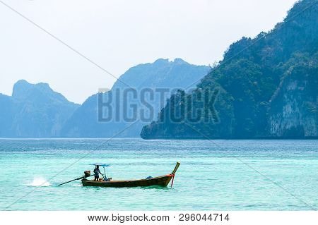 Beautiful Landscape With Traditional Boat On The Sea In Phi Phi Region, Thailand. Travel, Holiday In