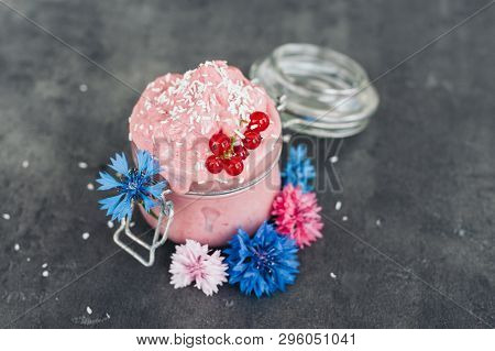 Delicious Strawberry Ice Cream Decorated With Coconut Flakes, Red Currant And Blue Cornflowers Again