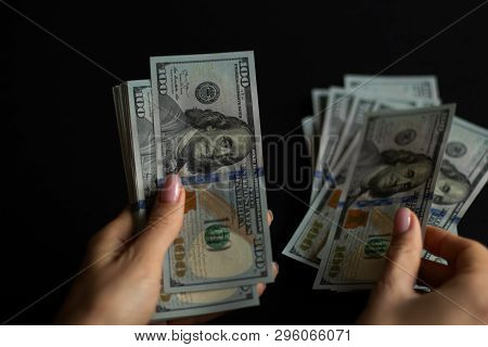 Hands Count Money Bills In 100 Dollars With Black Background