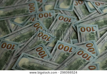 A Lot Of Bills In 100 Dollars On The Table