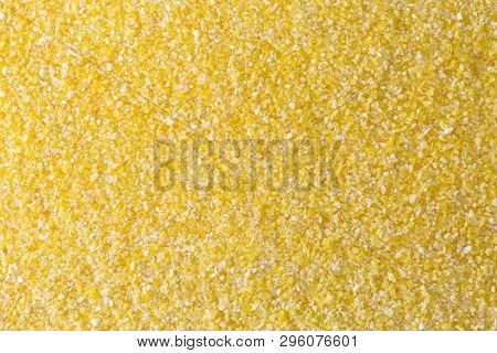 Texture of Polenta, yellow Cornmeal flour, Semolina, fast cooking closeup of grains
