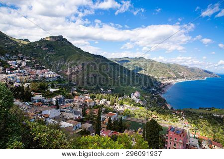 Beautiful Landscape Panorama Of Sicily Coastline. Blue Mediterranean Sea And Green Mountians, Taormi