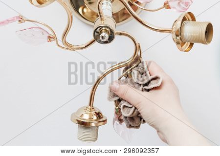Lamp On The Ceiling Without Lamps. Girl Washes His Rag. Have Toning. Close-up