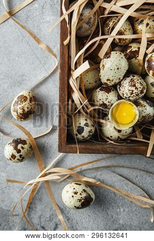 Quail Eggs. Flat Lay Composition With Small Quail Eggs In The Wooden Box On The Concrete Background.