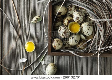 Quail Eggs. Flat Lay Composition With Small Quail Eggs On The Natural Wooden Background. One Broken