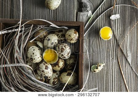 Quail Eggs. Flat Lay Composition With Small Quail Eggs On The Natural Wooden Background. One Broken