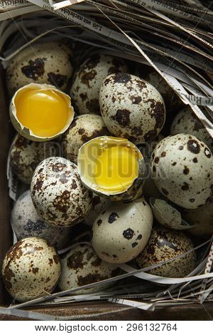 Quail Eggs. Flat Lay Composition With Small Quail Eggs On The Natural Wooden Background. One Broken