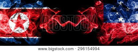 North Korea Vs Samoa, Samoan Smoky Mystic Flags Placed Side By Side. Thick Colored Silky Smoke Flags