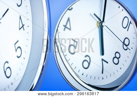 Concept Of Lost, Cycle Time. Time Passing. Reflection Of Clock Face In The Mirror.