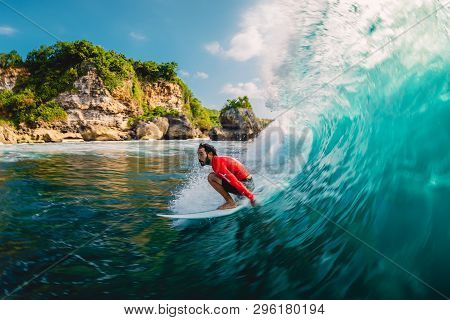 April 18, 2019. Bali, Indonesia. Surfer Ride On Barrel Wave. Professional Surfing At Big Waves In Pa
