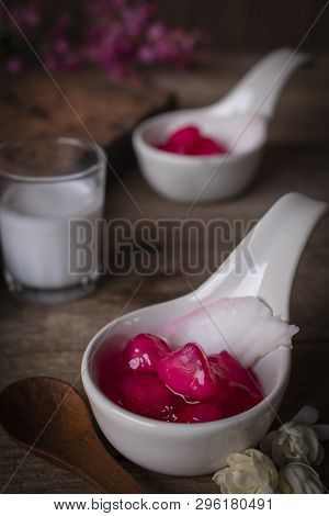 Thapthim Krop, Mock Pomegranate Seeds In Coconut And Syrup In The White Spoon Bowl On The Wood Table