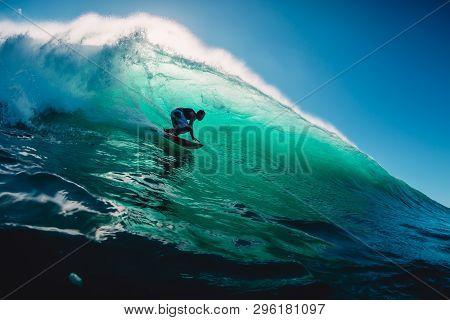 April 18, 2019. Bali, Indonesia. Surfer Ride On Barrel Wave. Professional Surfing At Big Waves In Pa