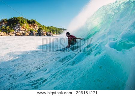 April 18, 2019. Bali, Indonesia. Surfer Ride On Barrel Wave. Professional Surfing At Big Waves In Pa