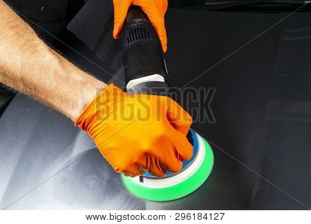 Car Polish Wax Worker Hands Applying Protective Tape Before Polishing. Buffing And Polishing Car. Ca
