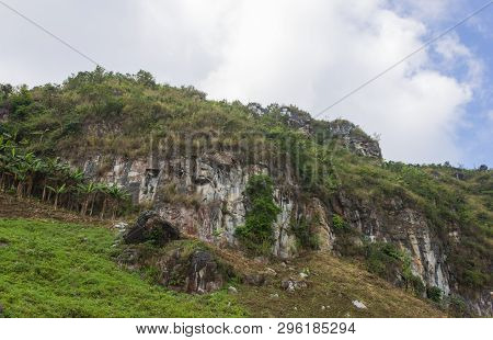 Stone Or Rock Mountain With Grass Sky And Cloud On Phu Chi Fa Forest Park. Landscape Phu Chi Fa Fore