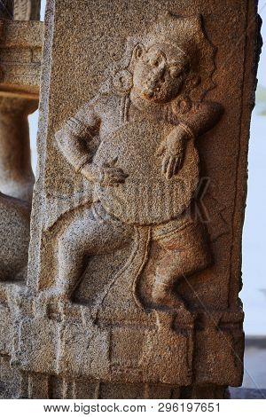 Sculpture Of Musician Playing Drum At The Vittala Temple, Hampi, Karnataka, India