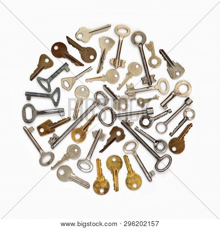 A Circle Of Keys On A White Isolated Background. Conceptual Photography. Old Keys.