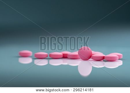 Round Pink Tablets Pill On Gradient Background. Vitamins And Minerals Plus Folic Acid Vitamin E And 