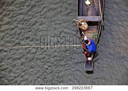 Meghalaya, India, September 2018, Boatman Rows His Boat At Umngot River, Dawki.