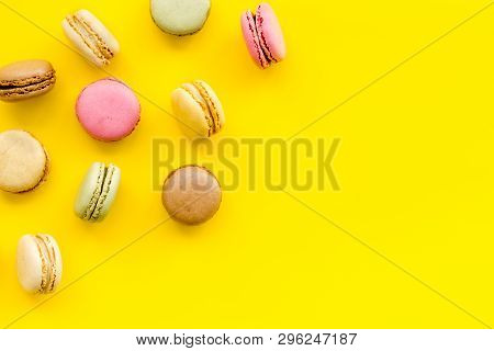 Brignt Macarons For Sweet Break On Yellow Background Top View Mock Up