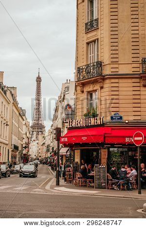 Paris, France - April 7, 2019: Beautiful Street In Paris With Traditional French Cafe And View On Ei