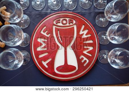 Near The Blackboard With The Inscription Time For Wine Are Glass Wine Glasses With High Legs And Cor