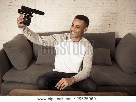 Young Happy Blogger Recording Video On Camera For Internet Blog