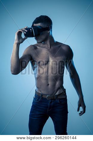 Sexy Young African Man Wearing Virtual Reality Headset Exploring 3D Experiences