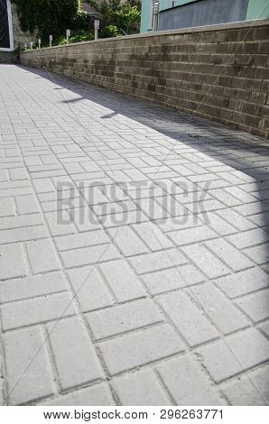 Ancient Pavement Leading Into The Distance With Vanishing Point As Ancient Background In Vintage Sty