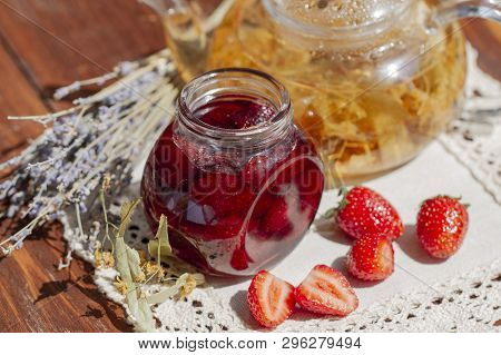 Strawberry Jam With Fresh Strawberries And Teapot Linden Lavender Tea And Flowers On Lace Linen Napk