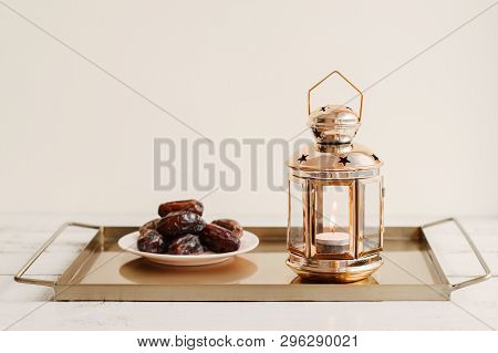 Tray With Gold Colored Lantern And Portion Of Dried Dates. Ramadan Month In The Middle East