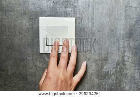 Female Hand, To Turn Off The Light, Switch, Front View.