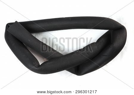 Piece Of A Knotted Insulating Tube,  Thermal Insulation Foam Tube. Pe Polyetylene Foam Insulation Tu