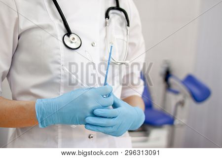 Gynecologist Doctor In White Uniform In Clinic Hospital With Medicine Instrument Vaginal Speculum, V