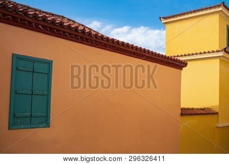 Colorful Traditional Building Facades With Turqiose And Green Vintage Windows In Athens, Greece