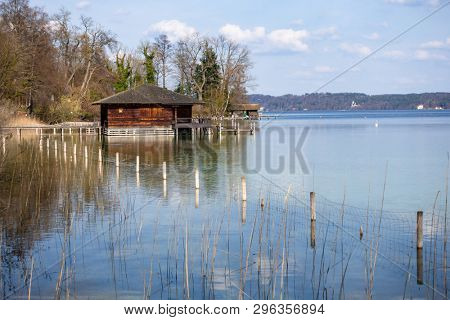 An image of a nice wooden boat house at Starnberg lake