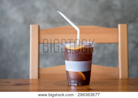 Iced Coffee Mixed With Orange Juice And Piece Of Fresh Orange