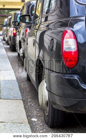London, Great Britain. April 12, 2019. Kensington Street. Cab Parking. London Cab Is Considered The 