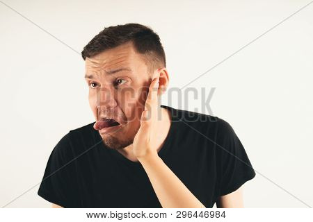 Crop Person Slapping Scared Man In Face
Emotional Male Getting Slapped In Face While Shouting With C