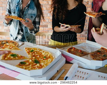 Pizza Time. Youth Eating Habit. Business Team Lunch. Group Of Colleagues Friends Taking Slices. Unhe